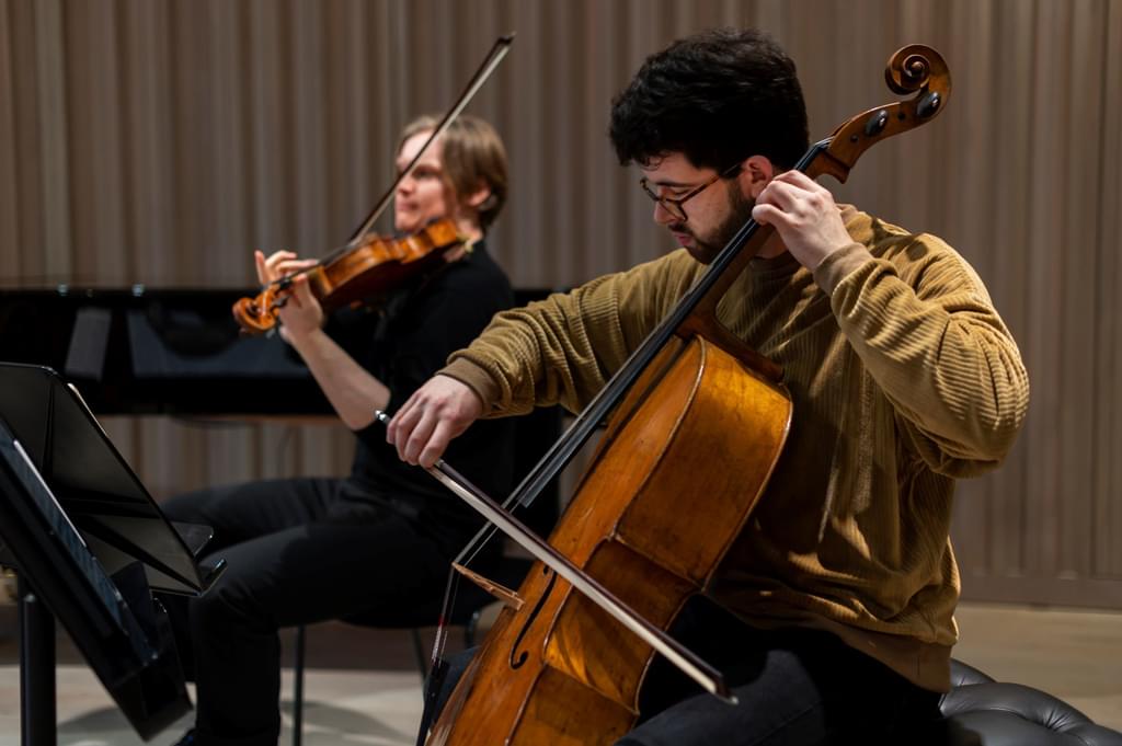 A string duo mid-performance