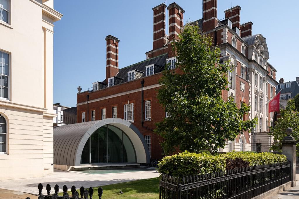 The front of the Academy building on a sunny day