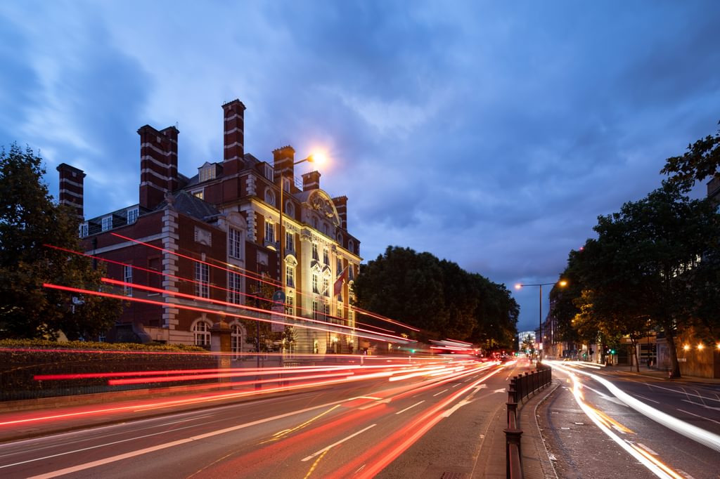 The front exterior of the Academy taken at night time from Marylebone Road