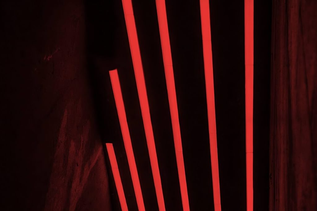 A decorative image of abstract red lights