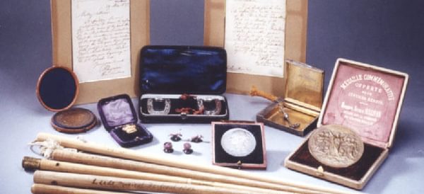 An assortment of trinkets and letters from the Academy's composer archive.