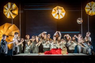 Scene from the Opera Semele with cast surrounding a fallen woman