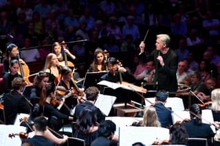 Ed Gardner conducts at a Prom