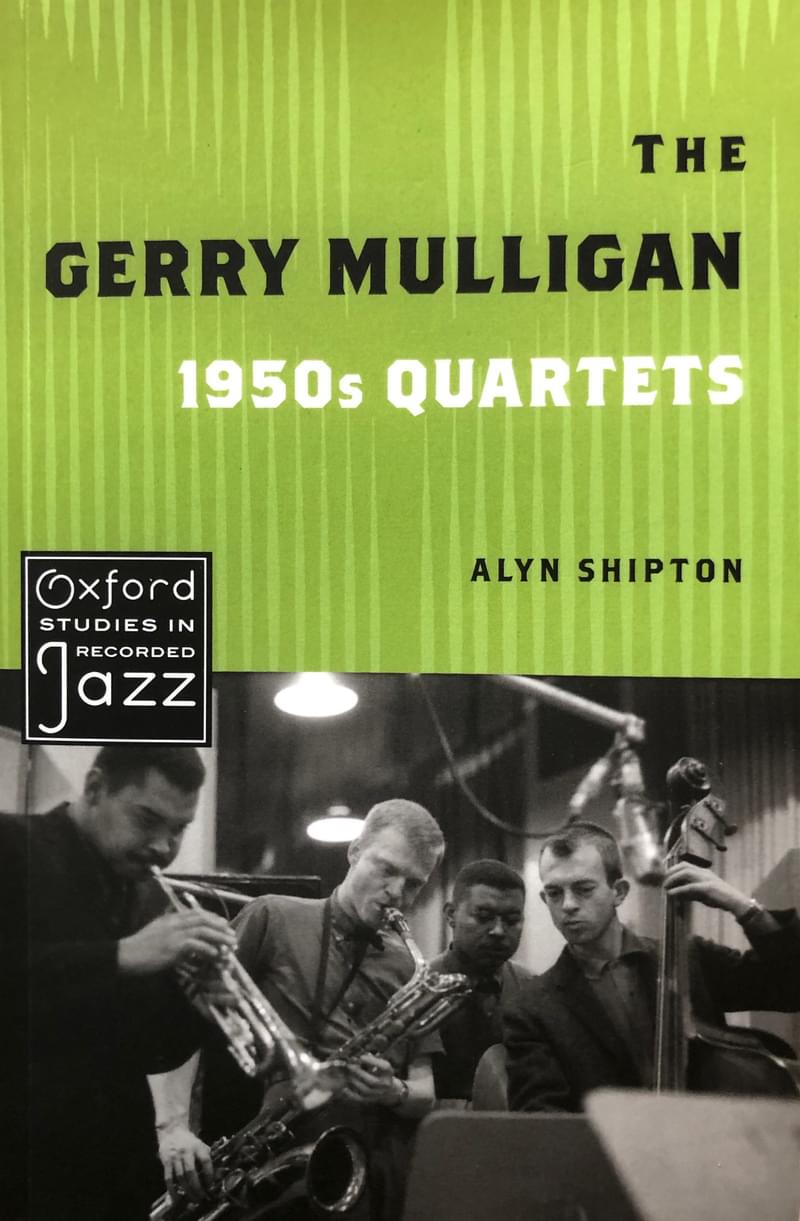 Book cover with title and black and white photo of 4 musicians playing