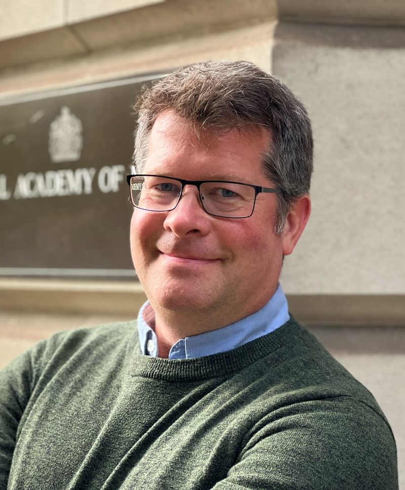 David Pyatt stands outside the Academy, facing camera