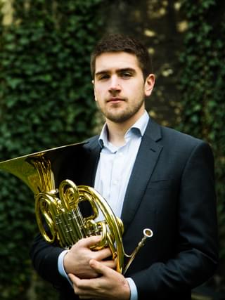 Ben Hulme holding a horn