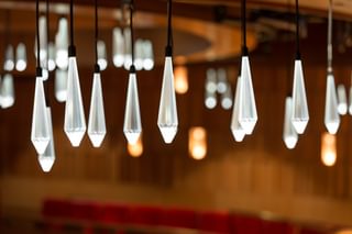 Ornate light fixtures shaped like crystals hanging from the ceiling