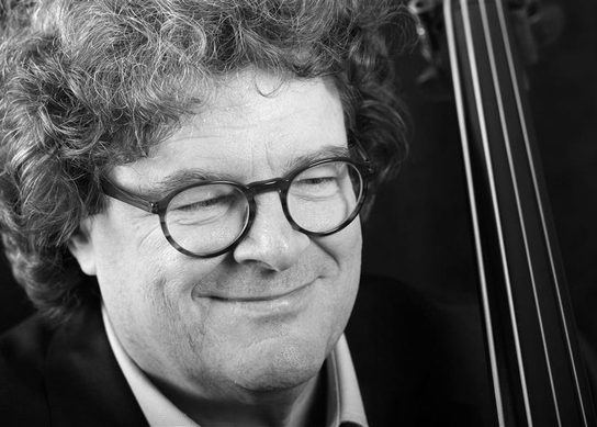Close up of Joel Quarrington and the neck of a bass
