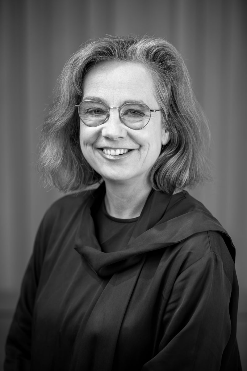 Profile of Elizabeth Kenny playing a guitar (black and white)