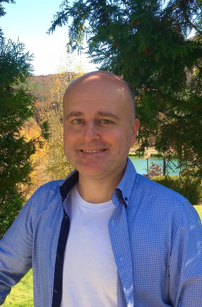 Sarkis Zakarian poses for camera in a rural setting