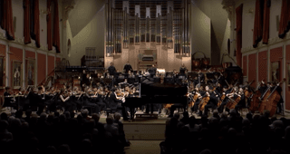 The Academy Symphony Orchestra play to a large audience