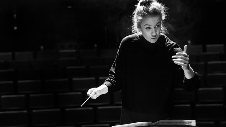 A conducting student in rehearsal