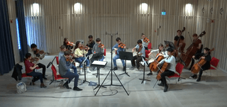 A string ensemble performs in the Angela Burgess Recital Hall
