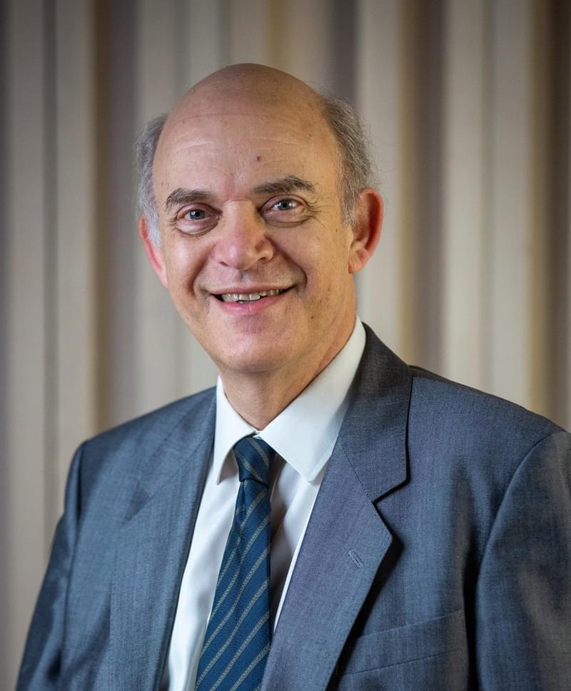 Portrait of Michael Lewin smiling for camera