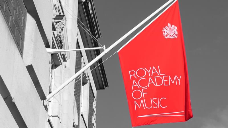The Academy's flag on the front of the building