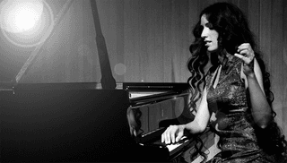 A piano player performing intensely