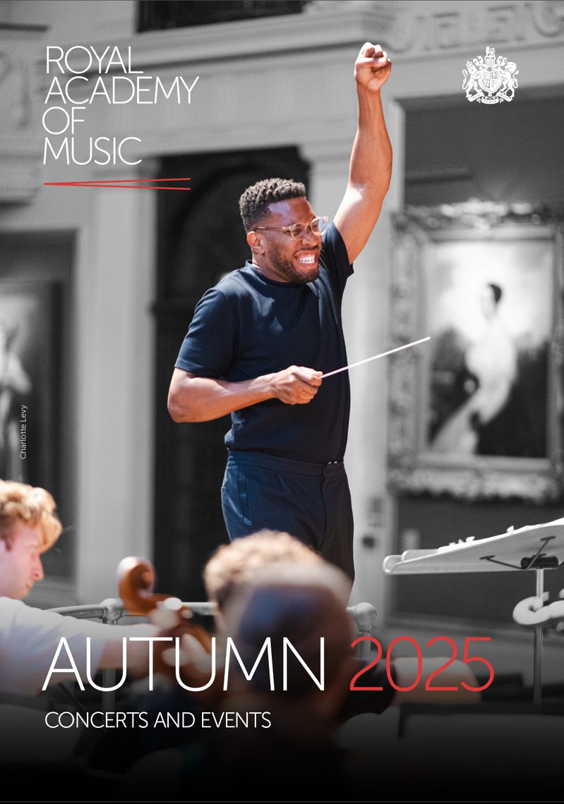 The front cover of the Royal Academy of Music's autumn diary publication, featuring an image of conductor Roderick Cox in rehearsal with students