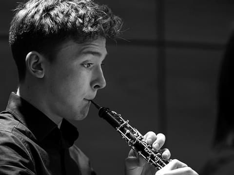 A student plays clarinet