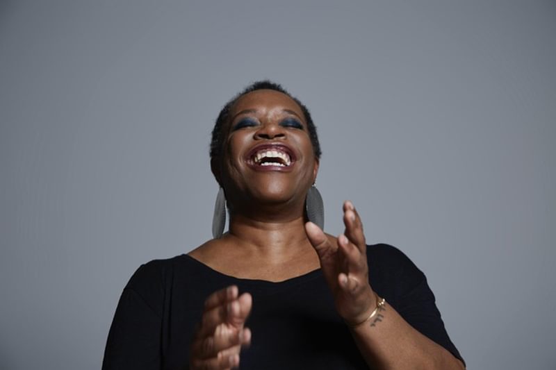 Allyson Devenish singing and smiling