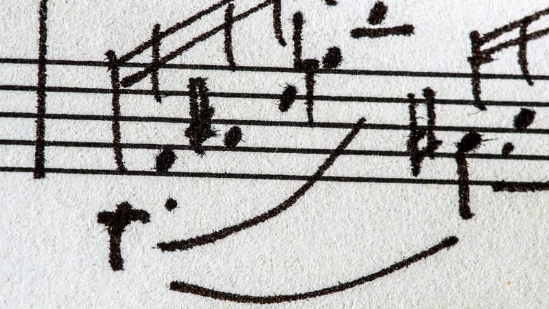 An extract of hand drawn musical notes on a musical stave