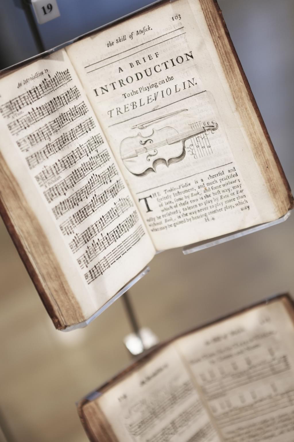 A book open on a page entitled 'a brief introduction to the playing on the treble violin'