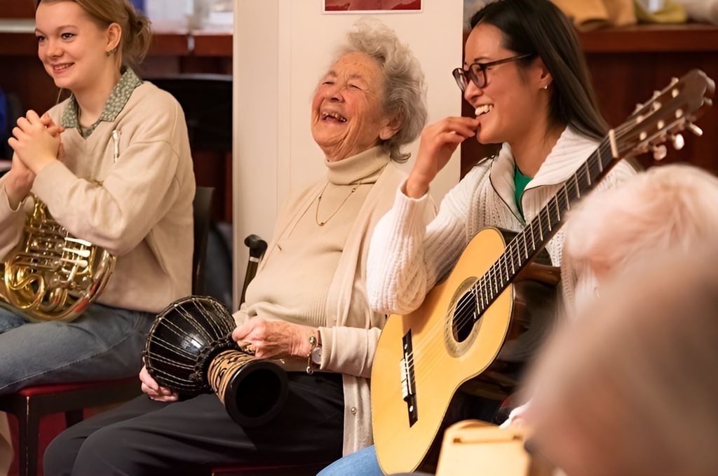 A Music for Life session. Workshop leader and Academy alumna Saki Kato (pictured right), next to a participant (pictured middle) and an Academy student (pictured left)