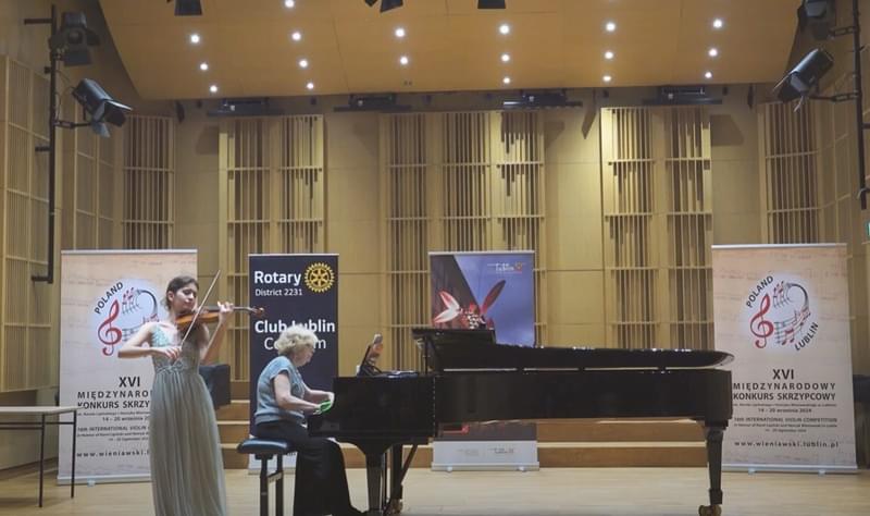 A violinist accompanied by a pianist