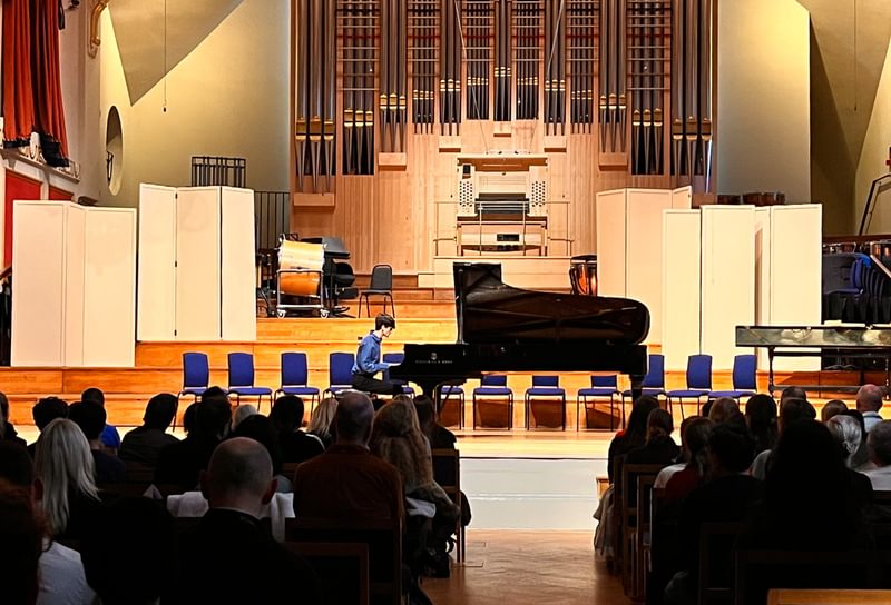 A piano student in concert