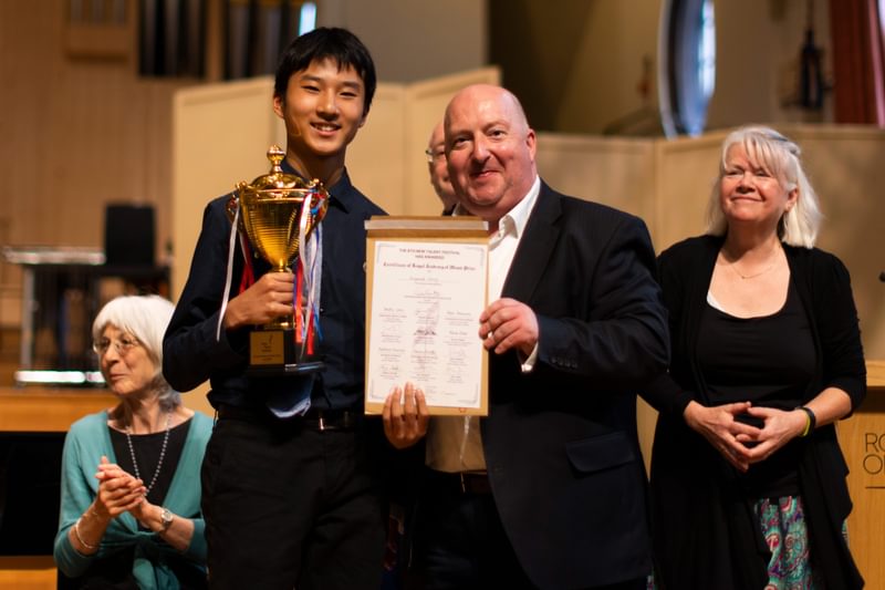 Academy Professors Timothy Jones and Jo Cole pose for a photo with prizewinners