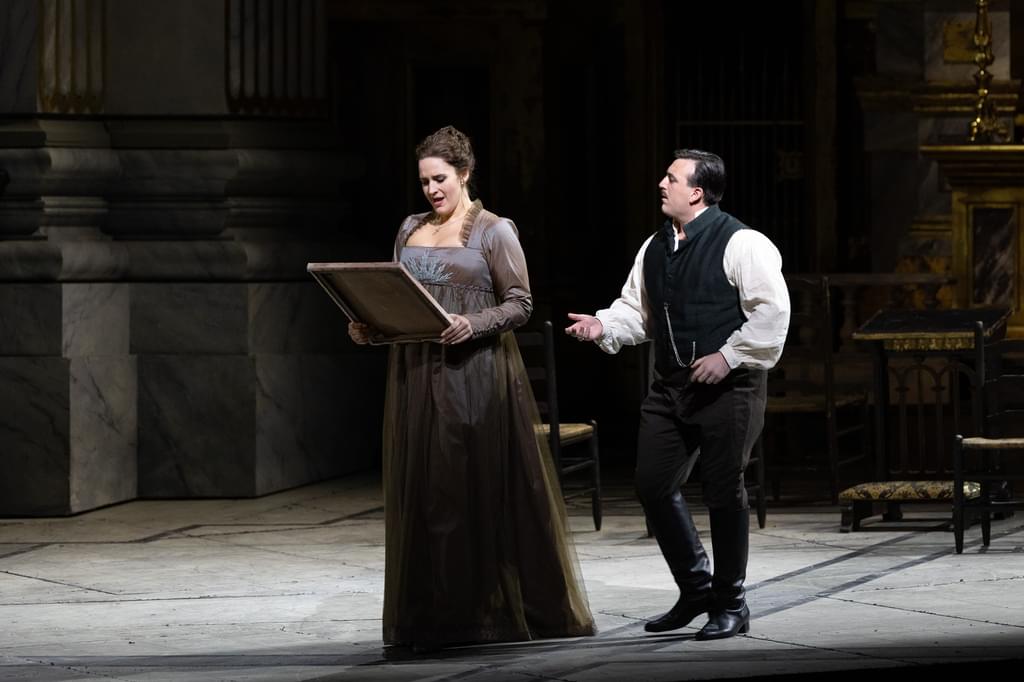 Two performers in a scene from the Opers Tosca