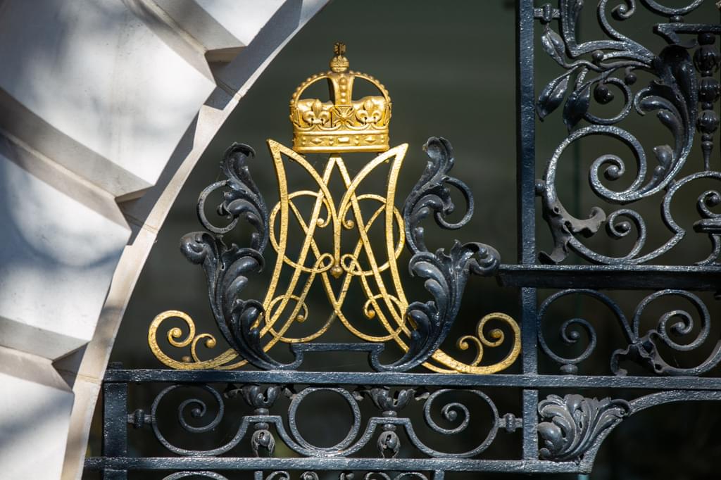 A photo of the decorative gilded Academy royal emblems above the main entranceway