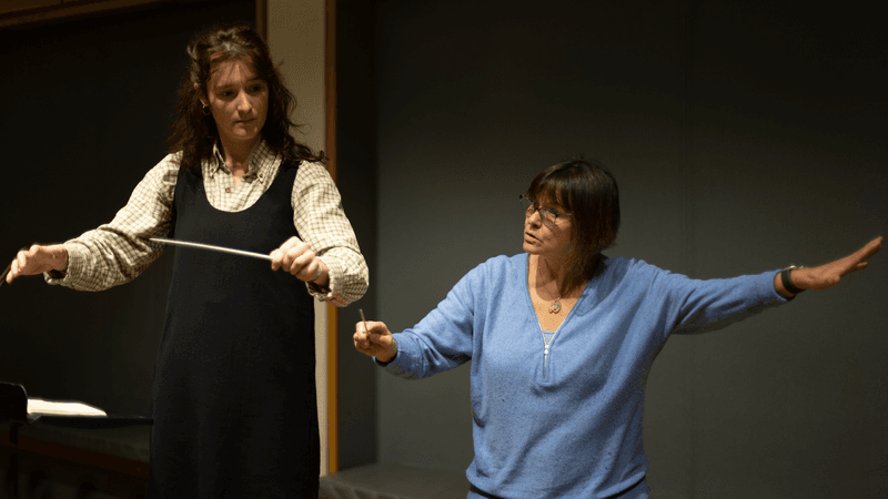 A conducting teacher and student
