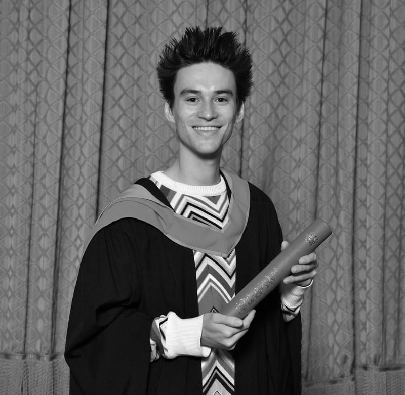 Jacob collier in graduation robes