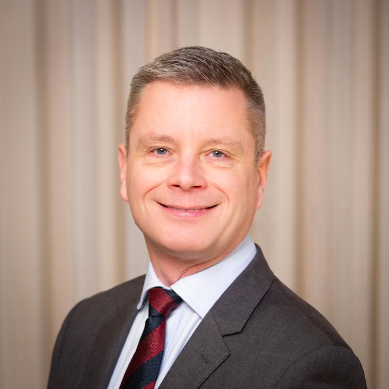 Headshot of Gavin Mann smiling to camera