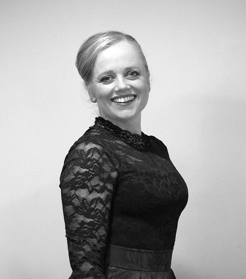 Side portrait of Kate Paterson in concert dress, smiling for camera